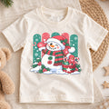 Cute Snowman Christmas Kids T-Shirt, Santa Hat Snowman with Candy Canes, Festive Winter Holiday Shirt, Toddler Xmas Gift — product view 1