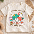 I Believe In Santa You Silly Goose Shirt, Funny Christmas Duck Kids T-Shirt, Cute Santa Bag Toddler Tee, Holiday Graphic Top, Xmas Gift — product view 1