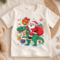 Santa Riding Dinosaur Shirt, Funny T-Rex Christmas Kids T-Shirt, Cute Dino Toddler Holiday Tee, Santa Claus Graphic Top, Xmas Dinosaur Gift — product view 1