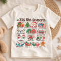 Tis the Season Kids Christmas Shirt, Santa Holiday Favorites Tee, Cute Christmas Icons Shirt for Boys and Girls, Festive Holiday Outfit — product view 1