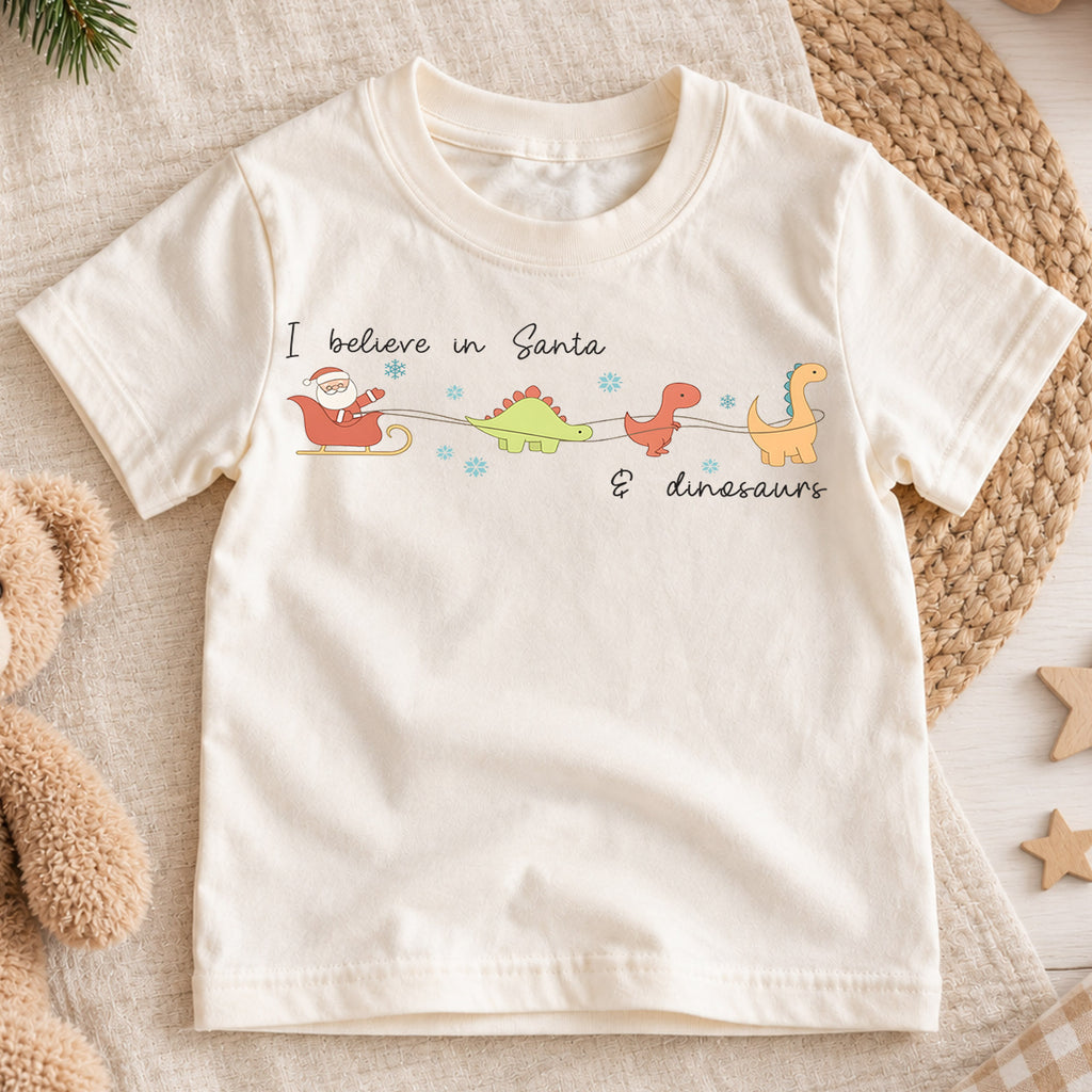 I Believe in Santa and Dinosaurs Kids Shirt, Funny Dinosaur Christmas Tee, Cute Minimal Holiday T Shirt for Kids — product view 1