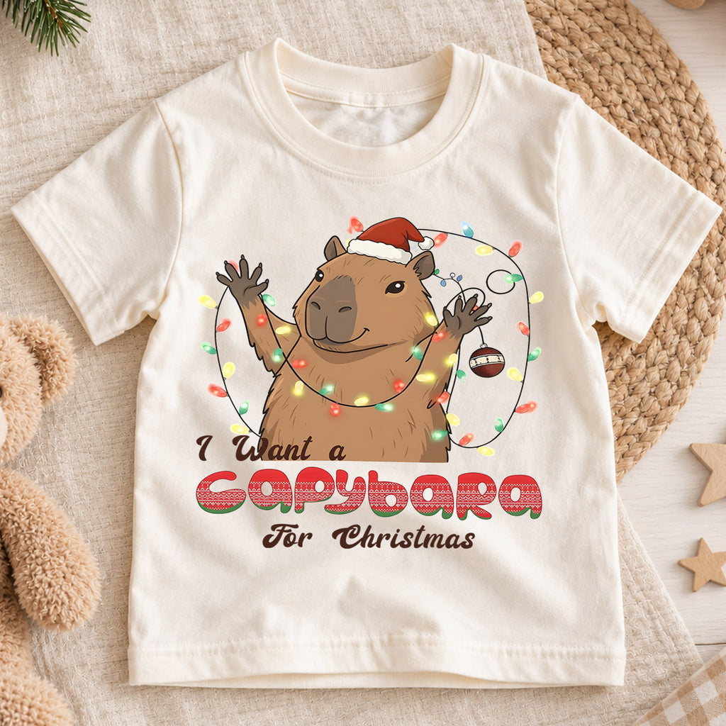 I Want a Capybara for Christmas Kids Shirt, Funny Capybara Holiday Tee, Cute Animal Christmas Shirt, Adorable Festive Gift for Kids — product view 1
