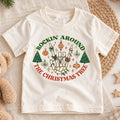 Rockin Around the Christmas Tree Kids Shirt, Skeleton Hand Holiday Tee, Retro Christmas T Shirt, Funny Xmas Gift for Kids — product view 1