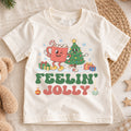 Feelin Jolly Kids Christmas Shirt, Cute Hot Cocoa Christmas Tree Tee, Retro Holiday Outfit, Festive Xmas Gift for Boys and Girls — product view 1