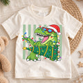 Christmas T Rex Kids Shirt, Dinosaur Santa Hat Holiday Tee, Christmas Tree Dino T Shirt, Cute Xmas Gift for Kids — product view 1