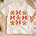 Gingerbread Bow Kids Christmas Shirt, Cute Cookie Holiday Tee, Red Bow Coquette Christmas Outfit for Girls, Sweet Festive Xmas Gift — product view 1